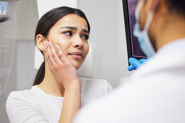 Clinical team examining a patient