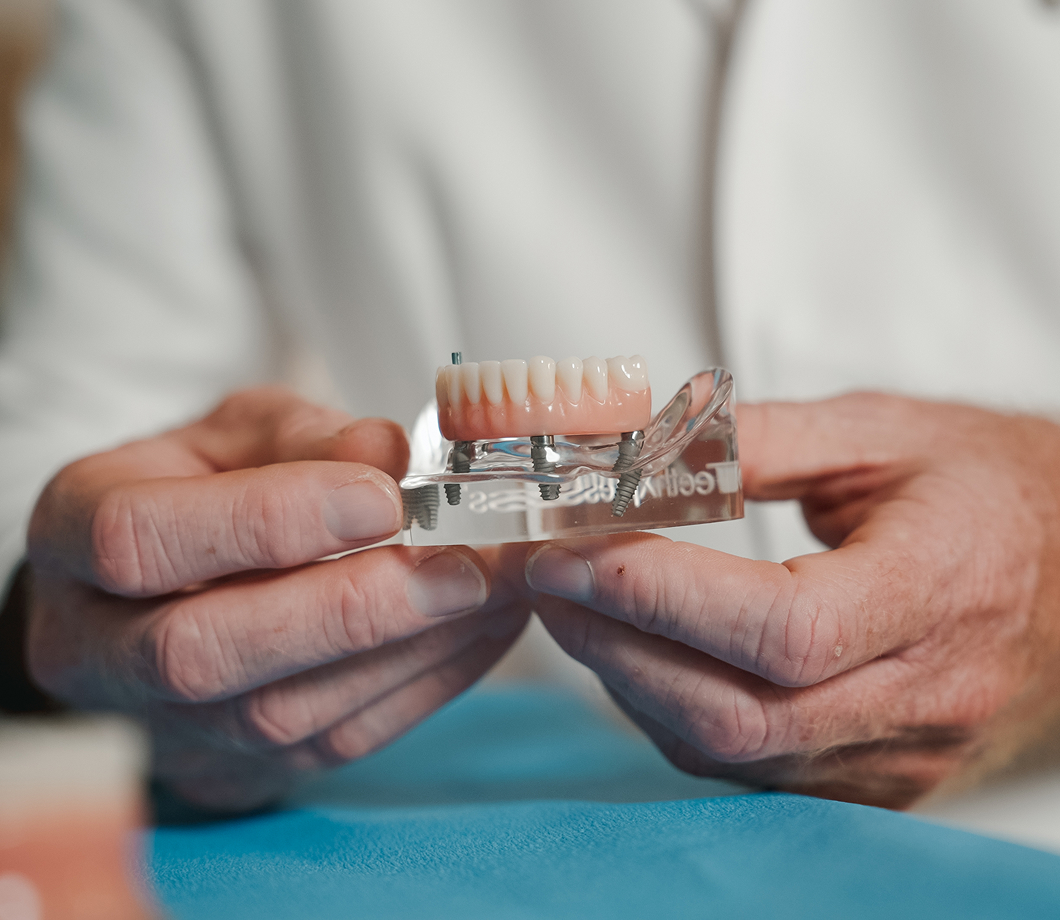 Patient seated for a tooth replacement consultation